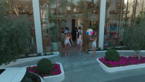 Dubai, UAE - 1 14 2023: The drone flies away from the facade of a nightclub. In Stock Footage 243166941