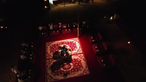 Dubai, UAE - 1 14 2023: A drone takes pictures of a spinning dancer wearing an Stock Footage 307932033