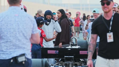Dubai, UAE - 1 20 2024: Racing car driver next to his car before the start of Stock Footage 278255270