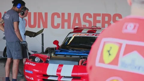 Dubai, UAE - 1 20 2024: The technical team of the race car inspects the car in Stock Footage 310724771