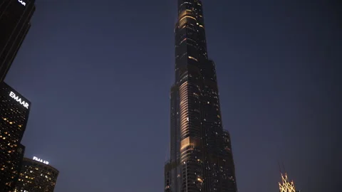 Dubai, UAE - 10 October 2024: Burj Khalifa illuminated at night in Dubai Stock Footage 304859627