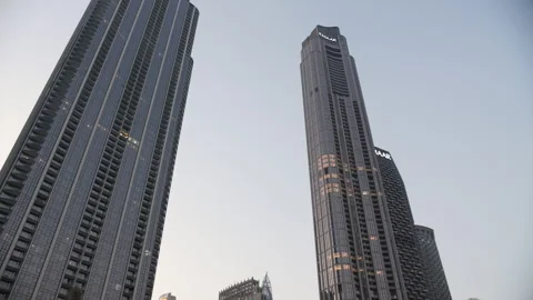 Dubai, UAE - 10 October 2024: Skyscrapers in Dubai under clear sky Stock Footage 304861008