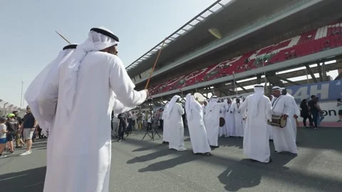 Dubai, UAE - 11 11 2023: Arab dancers in national clothes at the opening of auto Stock Footage 279531100