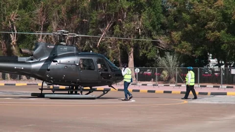 Dubai, UAE - 11 11 2023: A small private pleasure helicopter with tourists on Stock Footage 310296906