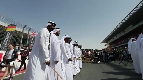 Dubai, UAE - 11 11 2023: Arab dancers in national clothes at the opening of auto Stock Footage 311795883