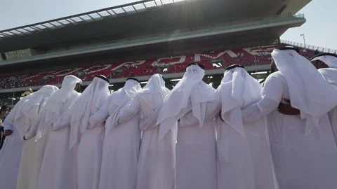 Dubai, UAE - 11 11 2023: Arab dancers in national clothes at the opening of auto Stock Footage 311795991