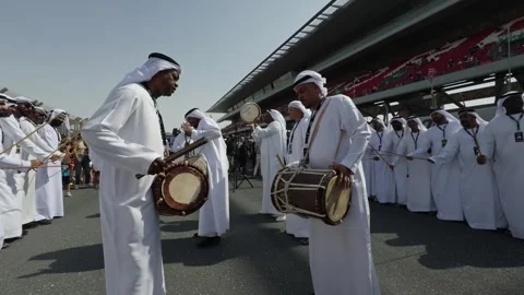 Dubai, UAE - 11 11 2023: Arab dancers in national clothes at the opening of auto Stock Footage 330333018