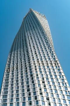 Dubai, UAE - 11.03.2017: Low angle wide vertical shot of Cayan Tower, or Stock Photos