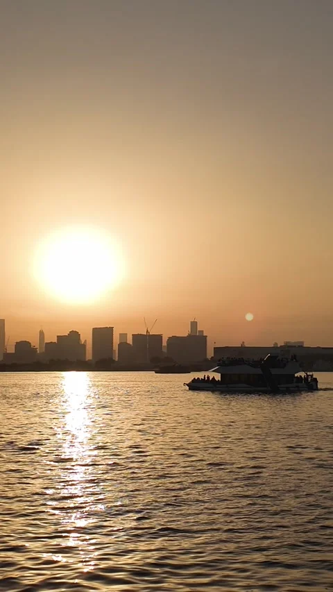 Dubai, UAE - 18 June 2026: Sunset view of Burj Khalifa skyline from Dubai C.. Stock Footage 337175198