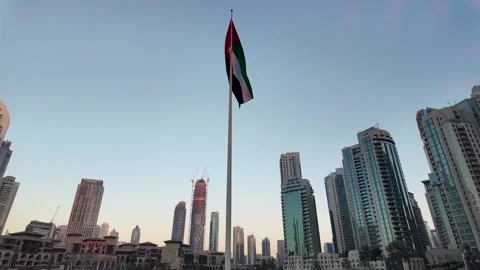 Dubai, UAE - 23 June 2026: Downtown skyline with Burj Khalifa and UAE flag Stock Footage 337499030