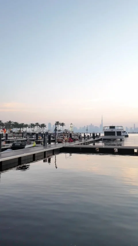 Dubai, UAE - 24 June 2026: Sunset and evening atmosphere at Dubai Creek wat.. Stock Footage 337548497