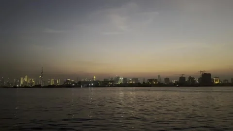 Dubai UAE 29 May 2026 Burj Khalifa skyline view from boat Stock Footage 335864502
