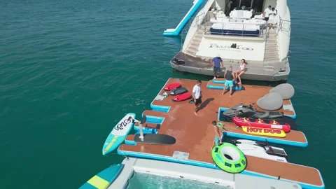 Dubai, UAE - 3 20 2023: A drone flies around a luxury private yacht standing in Stock Footage 277322751