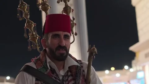 Dubai, UAE - 4 11 2018: A man in national Turkish clothes with musical Stock Footage 246288189
