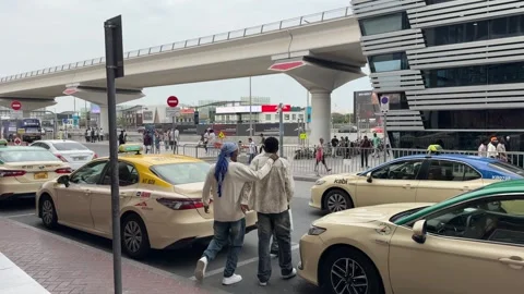 DUBAI, UAE - APRIL 15, 2026: Commuters and tourists using the Dubai Metro a.. Stock Footage 332770989