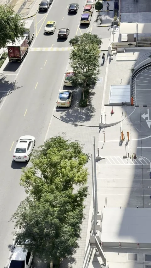 DUBAI, UAE - APRIL 15, 2026: A high-angle, top-down view looking over a bus.. Stock Footage 332792019