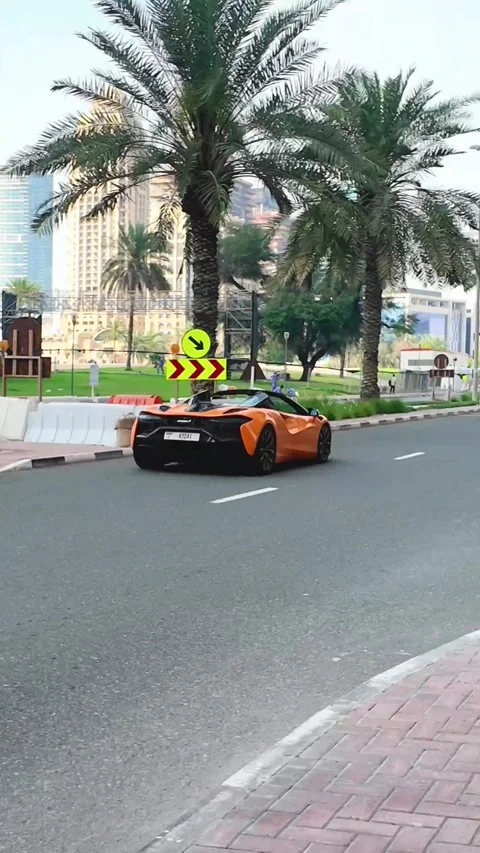 DUBAI, UAE - APRIL 16, 2026: Luxury supercars and high-end SUVs driving on .. Stock Footage 332835565
