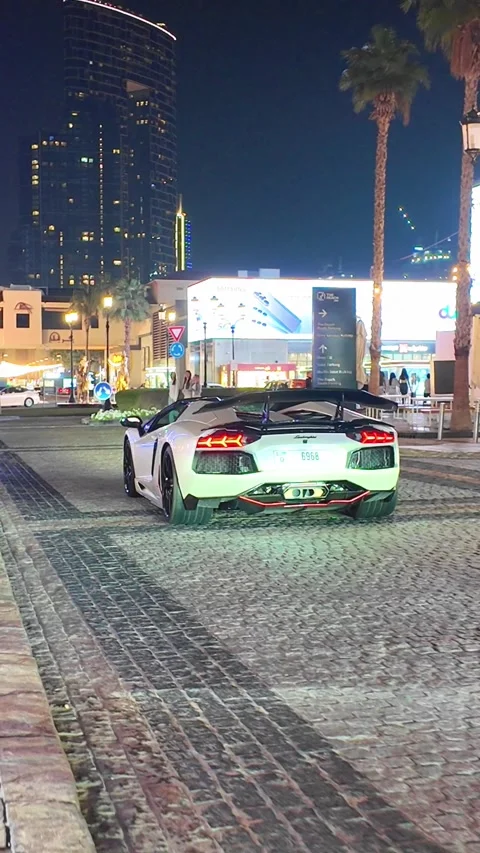 DUBAI, UAE - APRIL 16, 2026: A diverse collection of luxury supercars, prem.. Stock Footage 332839927