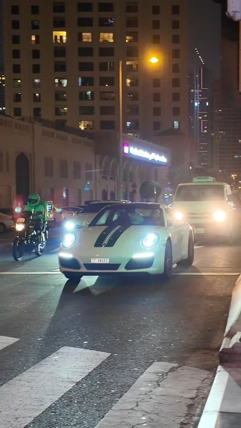 DUBAI, UAE - APRIL 16, 2026: A diverse collection of luxury supercars, prem.. Stock Footage 332840228