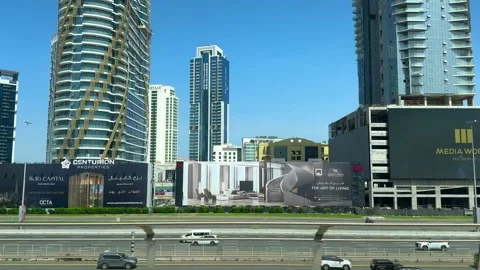 DUBAI, UAE - APRIL 18, 2026: Dubai Metro Views, Burj Al Arab, and City Landmarks Stock Footage 332998370