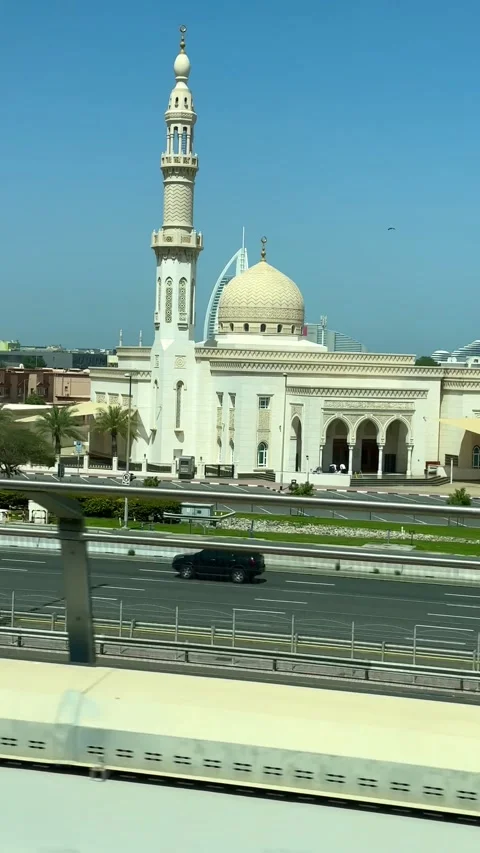DUBAI, UAE - APRIL 18, 2026: Dubai Metro Views, Burj Al Arab, and City Landmarks Stock Footage 332998401
