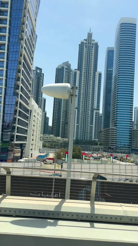 DUBAI, UAE - APRIL 18, 2026: Dubai Metro Views, Burj Al Arab, and City Landmarks Stock Footage 332998462