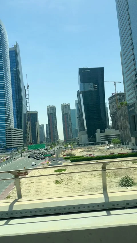 DUBAI, UAE - APRIL 18, 2026: Dubai Metro Views, Burj Al Arab, and City Landmarks Stock Footage 332998470