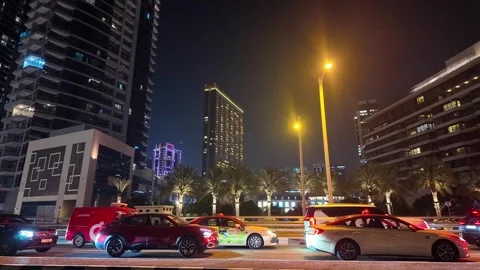 DUBAI, UAE - APRIL 23, 2026: Cinematic night view of Dubai Marina and JBR s.. Stock Footage 333307692