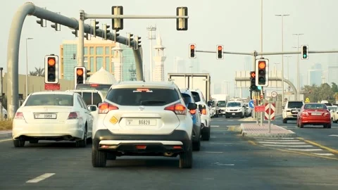 Dubai, UAE - August 04, 2024: Cars waiting at a traffic light in Dubai City. Stock Footage 280980814