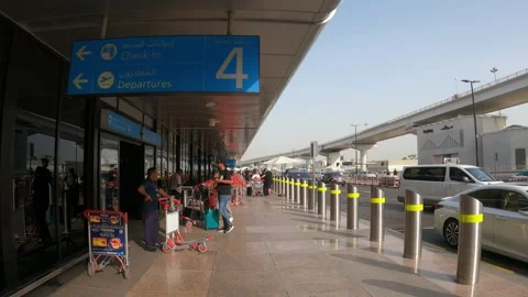 Dubai, UAE - August 23, 2024 - exterior view of Terminal 1 at DXB Stock Footage 293363629