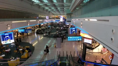 Dubai, UAE - August 23, 2024 - the main gate area at Terminal 1 of DXB Stock Footage 293799392