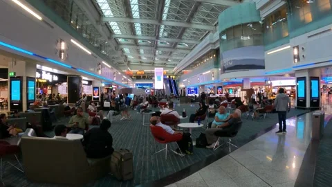 Dubai, UAE - August 23, 2024 - the main gate area at Terminal 1 of DXB Stock Footage 293799393