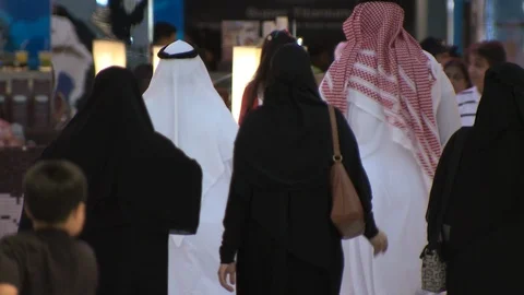 DUBAI, UAE - CIRCA FEBRUARY 2016: Arab Emirati family in mall Stock Footage