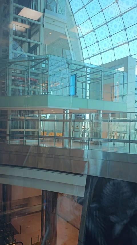 Dubai, UAE December 03 2024 Elevator at The Dubai Airport  arrival hall. Stock Footage 299875257