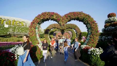 Dubai, UAE - December 14, 2019: Colorful heart shaped flowers alley in Dubai Stock Footage 129667554