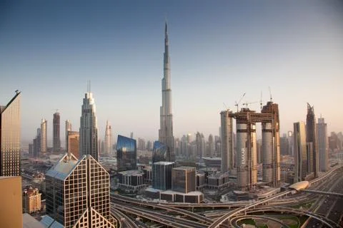 DUBAI, UAE - FEBRUARY 2018: Dubai skyline at sunset with Burj Khalifa, the wo Stock Photos