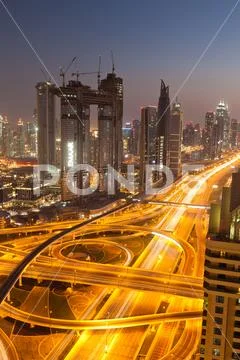 DUBAI, UAE - FEBRUARY 2018: Dubai skyline at sunset with Burj Khalifa, the wo Stock Photos