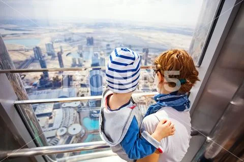 DUBAI, UAE - FEBRUARY 24: Young woman and her toddler son Stock Photos