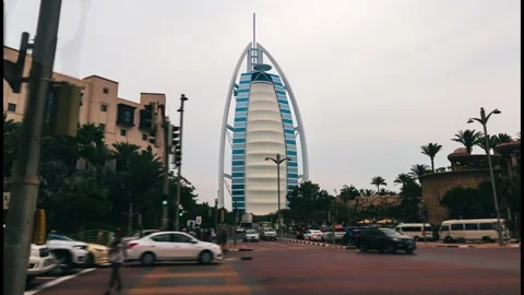 Dubai, UAE - A hyperlapse of Burj Al Arab and moving traffic cars Stock Footage 240973522