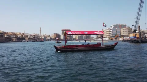 Dubai, Uae - Jan 05, 2025: Traditional Abra Boat Sailing Along Dubai Creek on Stock Footage 303674357