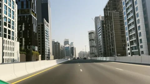 Dubai, Uae - Jan 05, 2025: Drive pov on highway along urban skyline view with Stock Footage 328189940