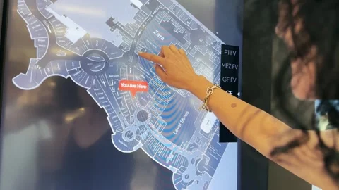 Dubai, Uae - Jan 05, 2025: Woman interacting with interactive touch screen  i Video stock 328190222
