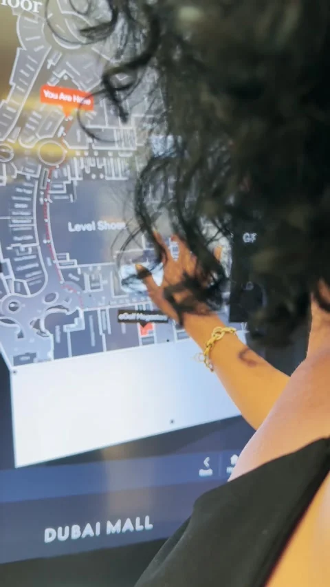 Dubai, Uae - Jan 05, 2025: Woman interacting with interactive touch screen  i Video stock 328190242