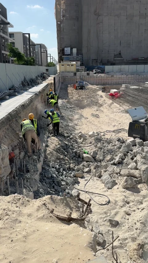 Dubai, UAE, January,4-2025:  Construction workers operate heavy machinery at  Stock Footage 310851348
