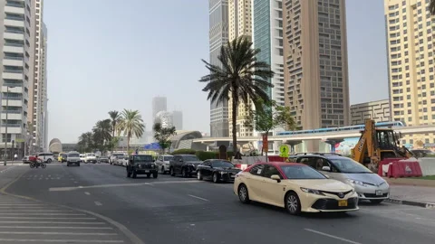 DUBAI, UAE - July 07,2021 Daytime Car Traffic Dubai main road. 4K Stock Footage 299529109