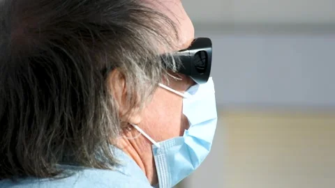 Dubai, UAE - July 29, 2024: Old European man wearing sunglasses and a face mask. Stock Footage 280462627