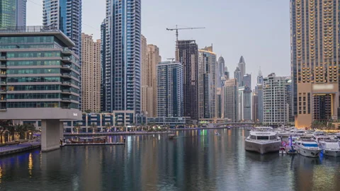Dubai, UAE - July, 7 2021 View of Dubai Marina promenade with yachts and modern Stock Footage 299528890