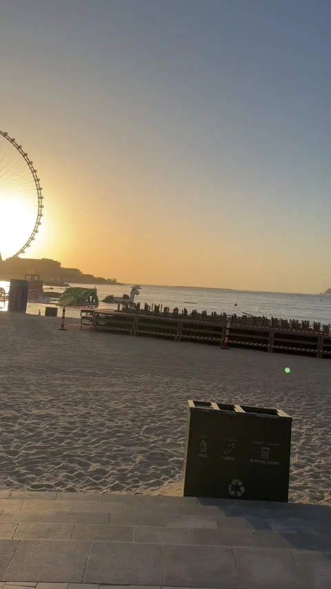 Dubai UAE July 7 2026 JBR beach and Dubai Marina evening cityscape with Ain.. Stock Footage 338381045
