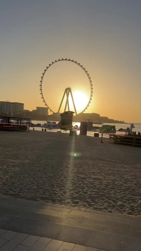 Dubai UAE July 7 2026 JBR beach and Dubai Marina evening cityscape with Ain.. Stock Footage 338381084