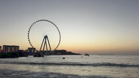 Dubai UAE July 7 2026 JBR beach and Dubai Marina evening cityscape with Ain.. Stock Footage 338381334